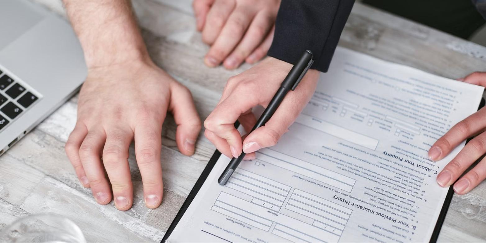 Health and life insurance policy documents being reviewed